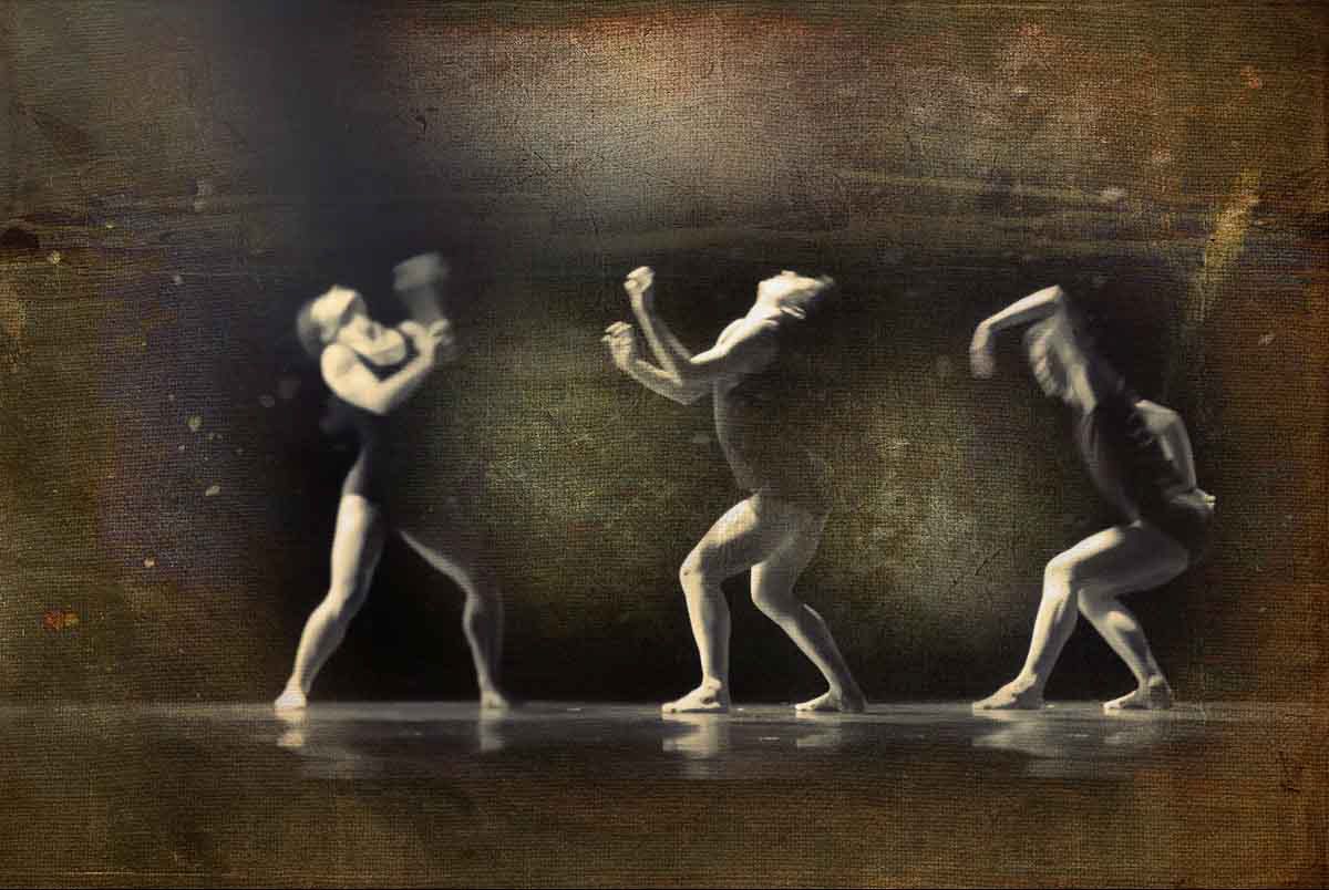 Three dancers in matching poses on a dark, textured bronze ground.